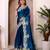 ethnic motifs embroidered georgette saree in teal