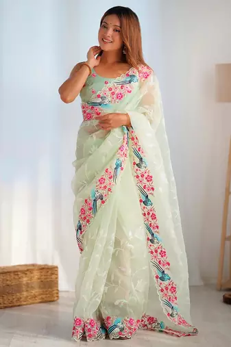 ethnic motifs embroidered georgette saree in green