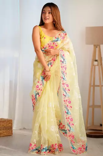 ethnic motifs embroidered georgette saree in yellow