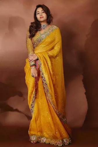 ethnic motifs embroidered georgette saree in yellow