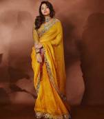 ethnic motifs embroidered georgette saree in yellow