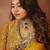 ethnic motifs embroidered georgette saree in yellow