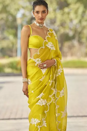 ethnic motifs embroidered georgette saree in yellow