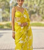 ethnic motifs embroidered georgette saree in yellow