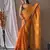Orange woven tissue saree with blouse piece