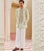 green silk kurta jacket set with embroidered floral work