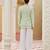 green silk kurta jacket set with embroidered floral work