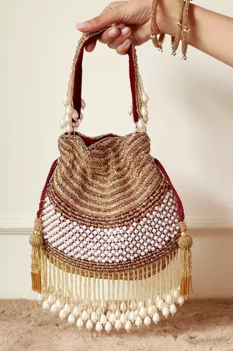 Gold suede pearl embroidered potli bag