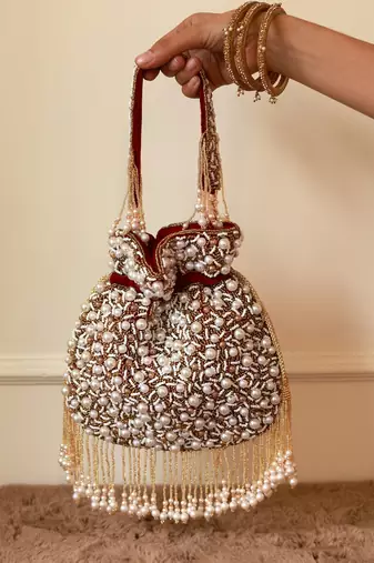 Red suede pearl embroidered potli bag