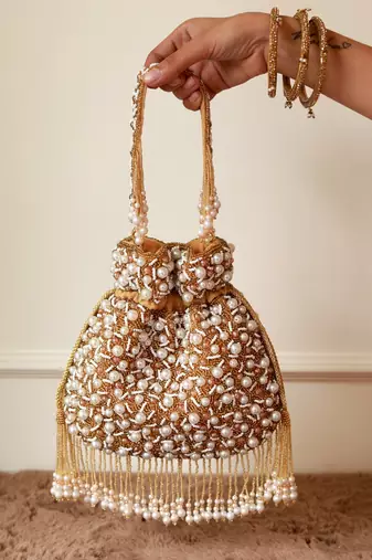 Gold suede pearl embroidered potli bag