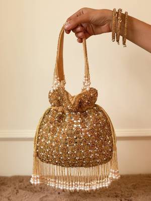 Gold suede pearl embroidered potli bag 5