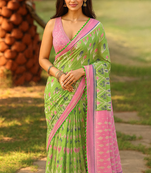Green and pink ikat print cotton saree with pom-pom detailing