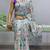 sky color  all over printed silk blend crape saree with unstitched blouse