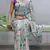 sky color  all over printed silk blend crape saree with unstitched blouse
