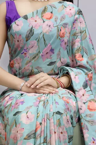 sky color  all over printed silk blend crape saree with unstitched blouse