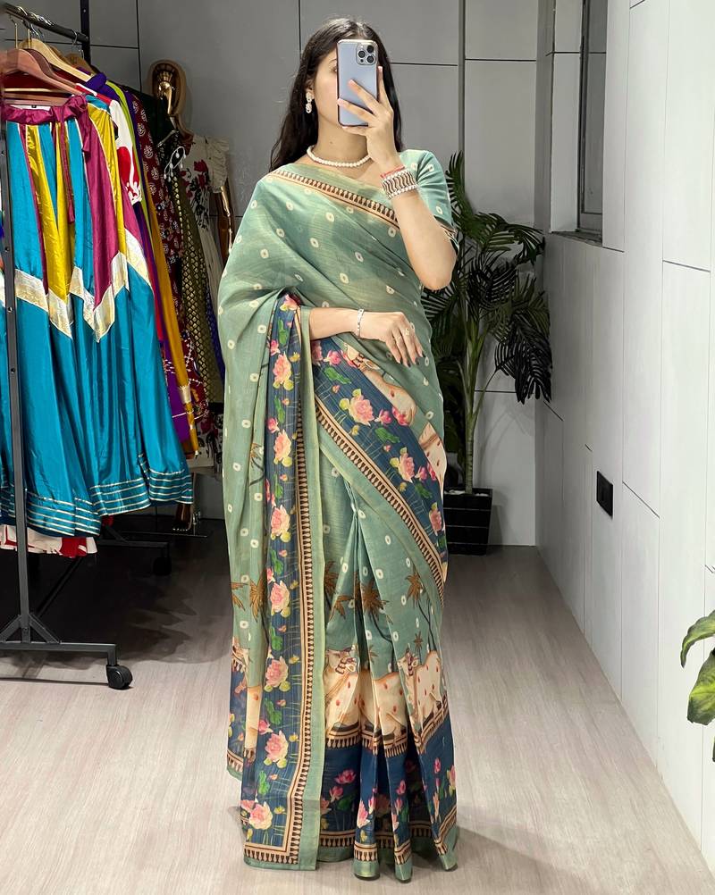 teal color  all over printed shimmer saree with unstitched blouse