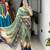 teal color  all over printed shimmer saree with unstitched blouse