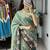 teal color  all over printed shimmer saree with unstitched blouse