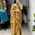 mustard color  all over printed shimmer saree with unstitched blouse