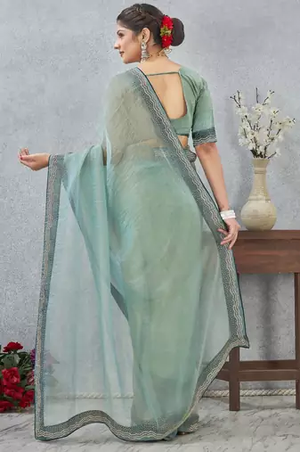 light green color zirkon work border soft silk blend saree with blouse