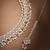 Pear shape pearl guchha antique gold plated white uncut kundan stone choker jewellery sets for women