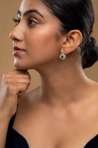 green silver dangler earrings with polished stone work