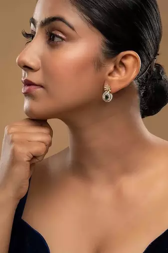 green silver dangler earrings with polished stone work