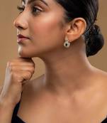 green silver dangler earrings with polished stone work