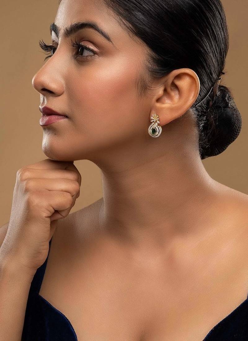 green silver dangler earrings with polished stone work