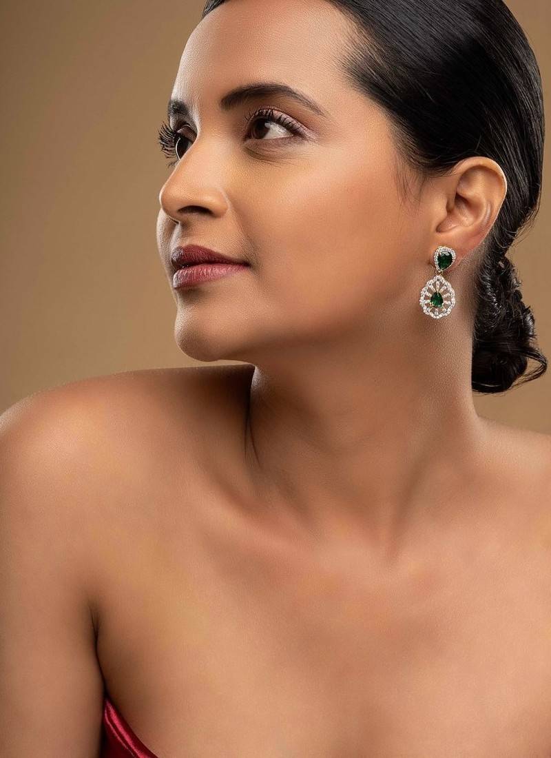 green sterling silver dangler earrings with gold finish
