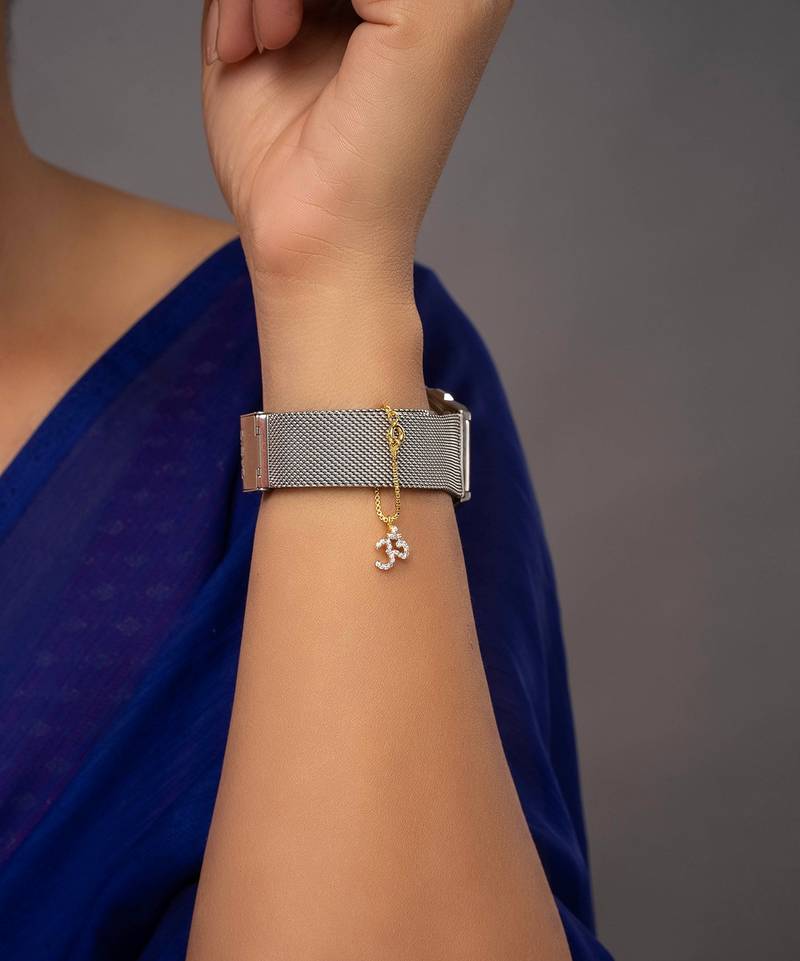 white silver watch charm with gold plated detailing