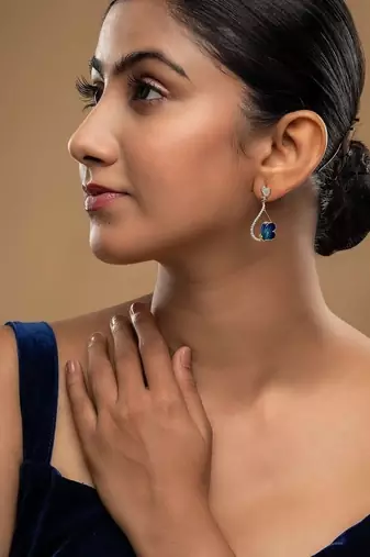  blue silver dangler earrings with gold stone drop design