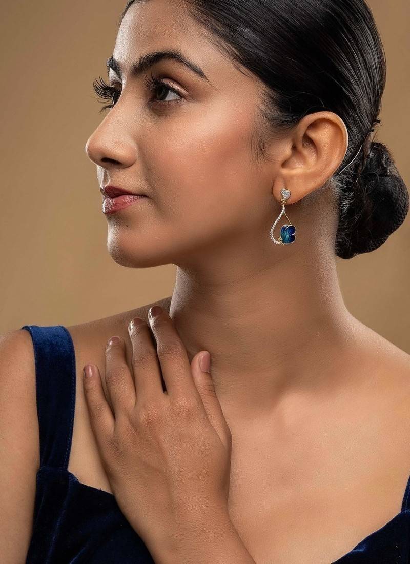  blue silver dangler earrings with gold stone drop design