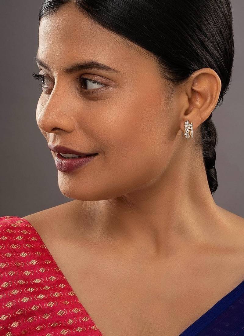 white silver earrings with gold plated minimal drop design