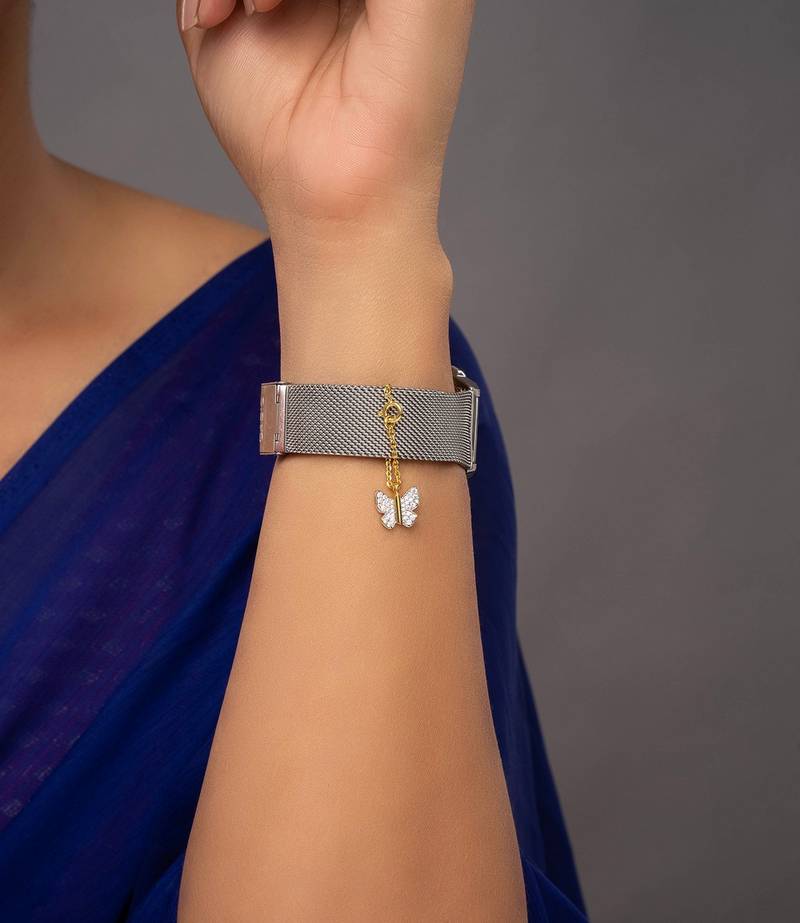 white silver watch charm with gold plated detail