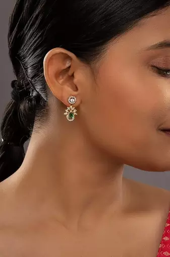 green silver dangler earrings with gold plated stone design