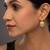 white silver jhumkas with gold plated traditional design