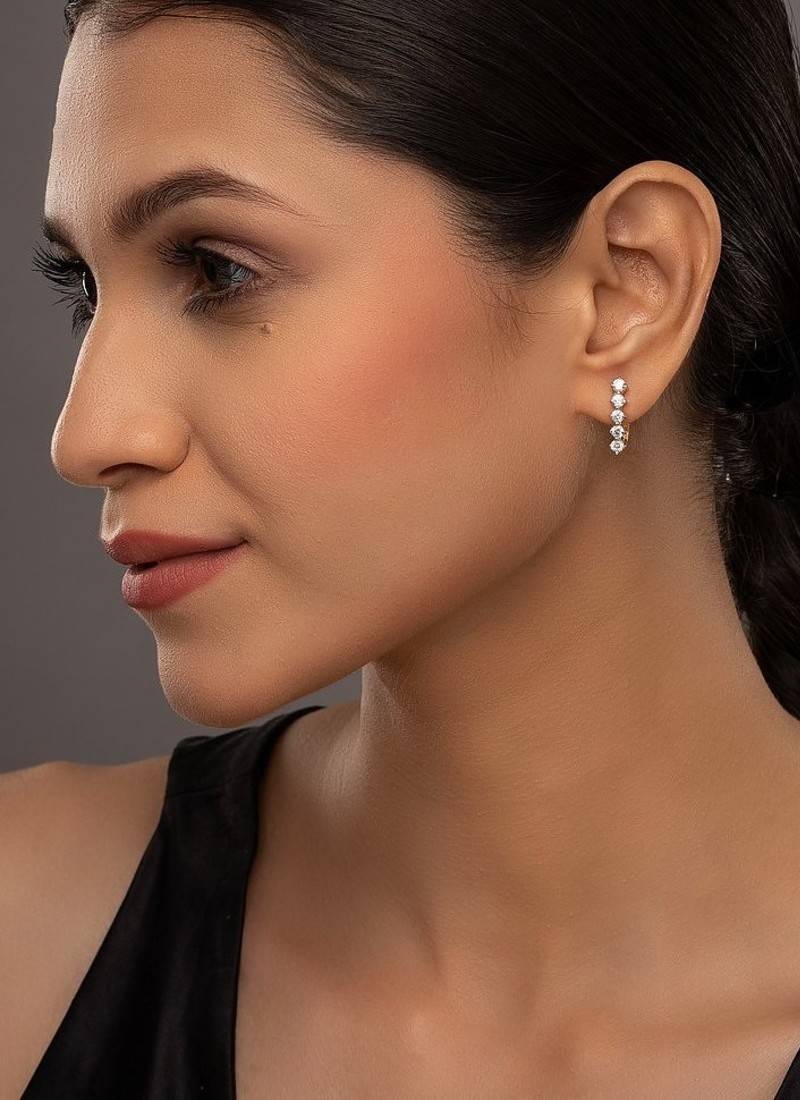 white silver earrings with gold sleek long dangler style