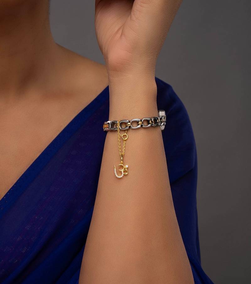 white silver watch charm with gold plated work