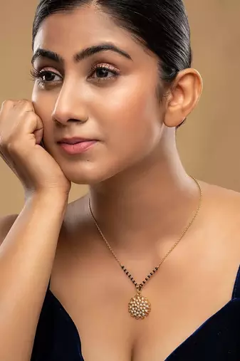 white silver mangalsutra with gold pendant black beads chain