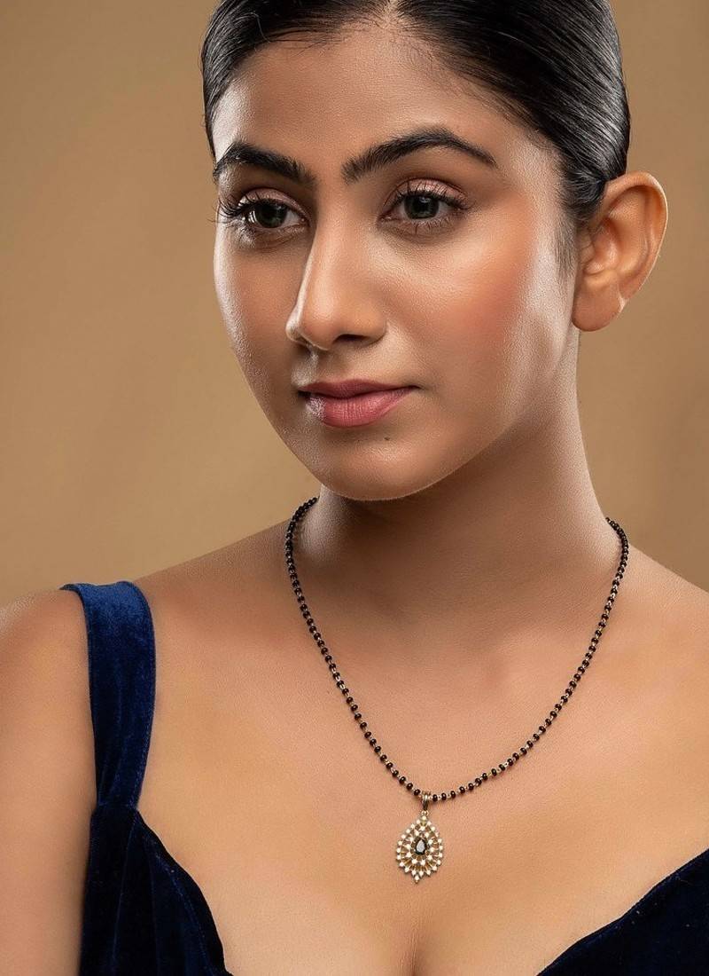 green silver mangalsutra with gold stone bead chain
