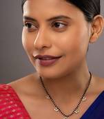 white silver mangalsutra with gold black bead pendant