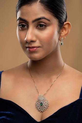 green silver necklace set with gold plated pendant design
