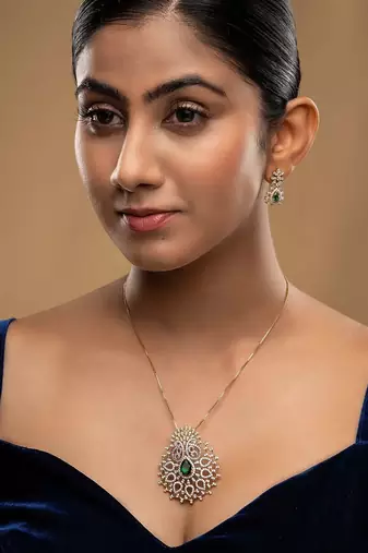 green silver necklace set with gold plated pendant design