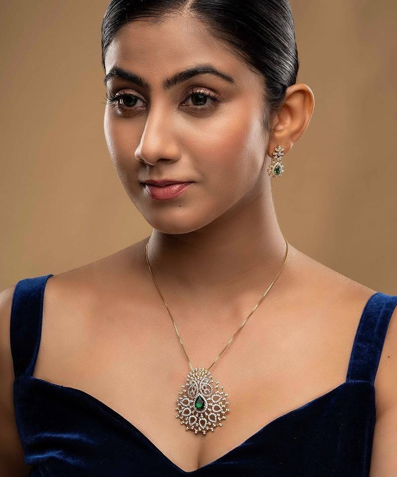 green silver necklace set with gold plated pendant design