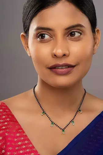 green silver mangalsutra with gold green stone pendant