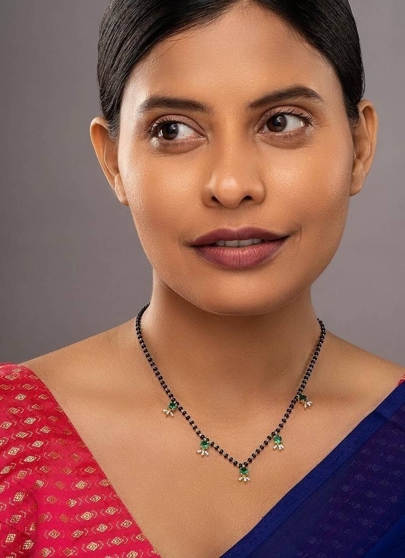 green silver mangalsutra with gold green stone pendant