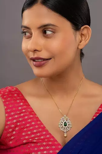 green silver pendant necklace with gold plated design