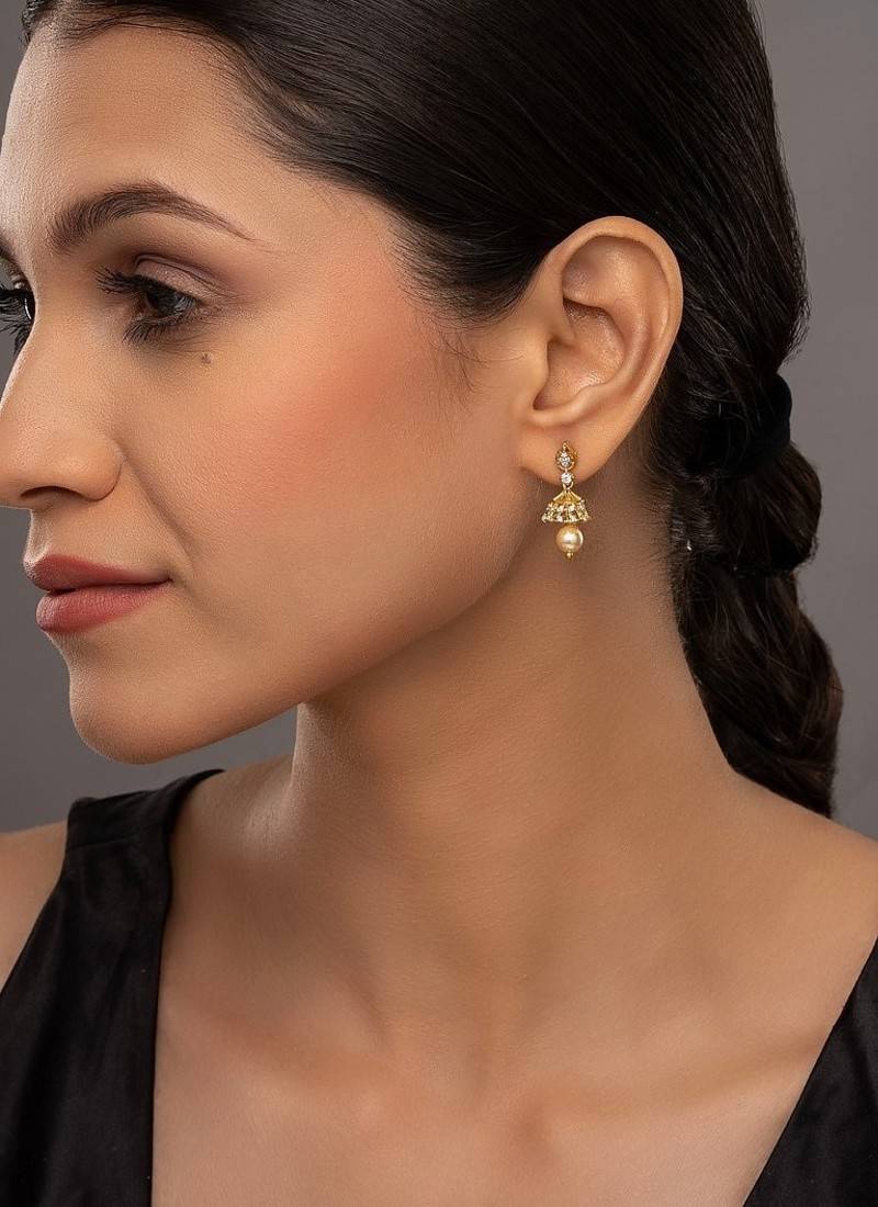 white silver jhumka earrings with gold plated detailing