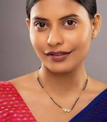 white silver mangalsutra with black beads gold locket